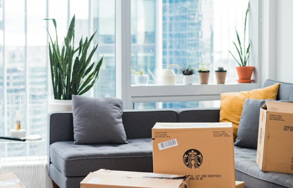 Packed moving boxes in modern apartment ready for relocation in Montreal.